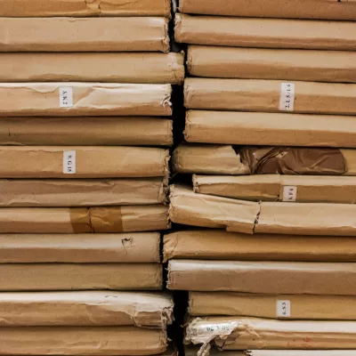 A stack of thin brown cardboard sheets